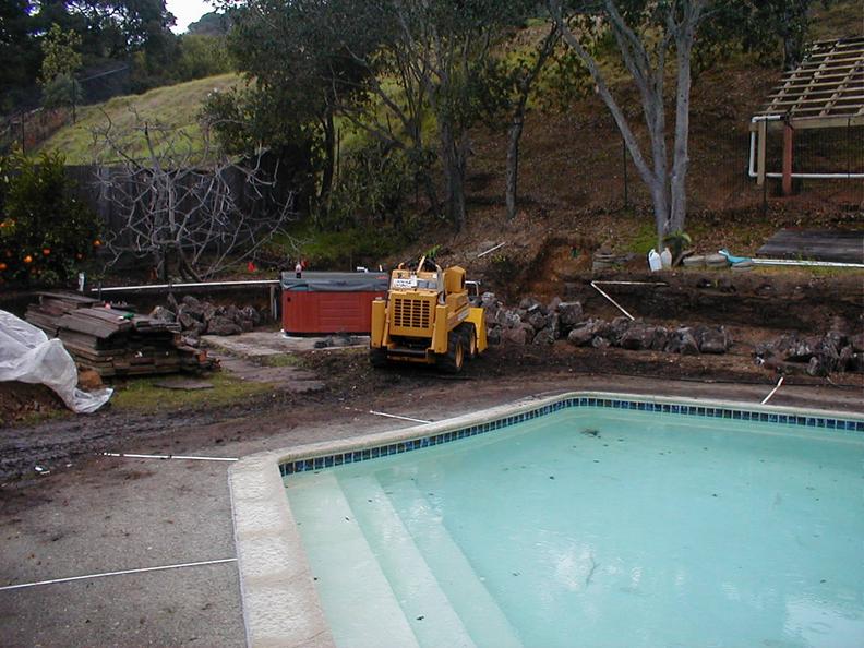 Before- Boulders, Pavers, New Sod & Rock Retaining Wall