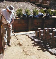 Preparing the grade just right before the pavers go down